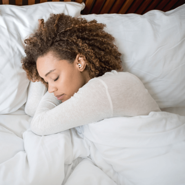 woman-sleeping-with-comfortable-ear-plugs