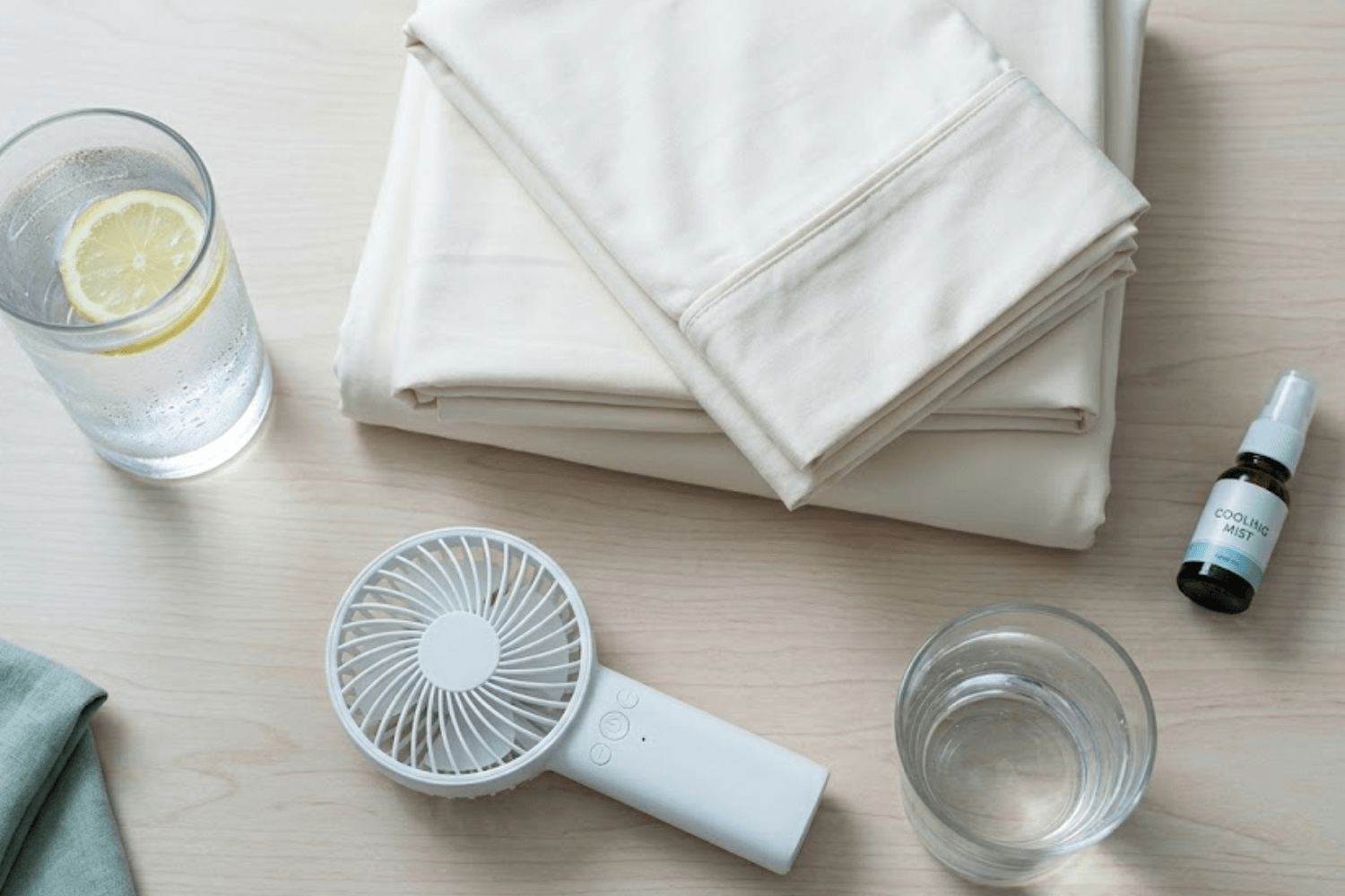 Kit of night sweat relief remedies including water and a fan