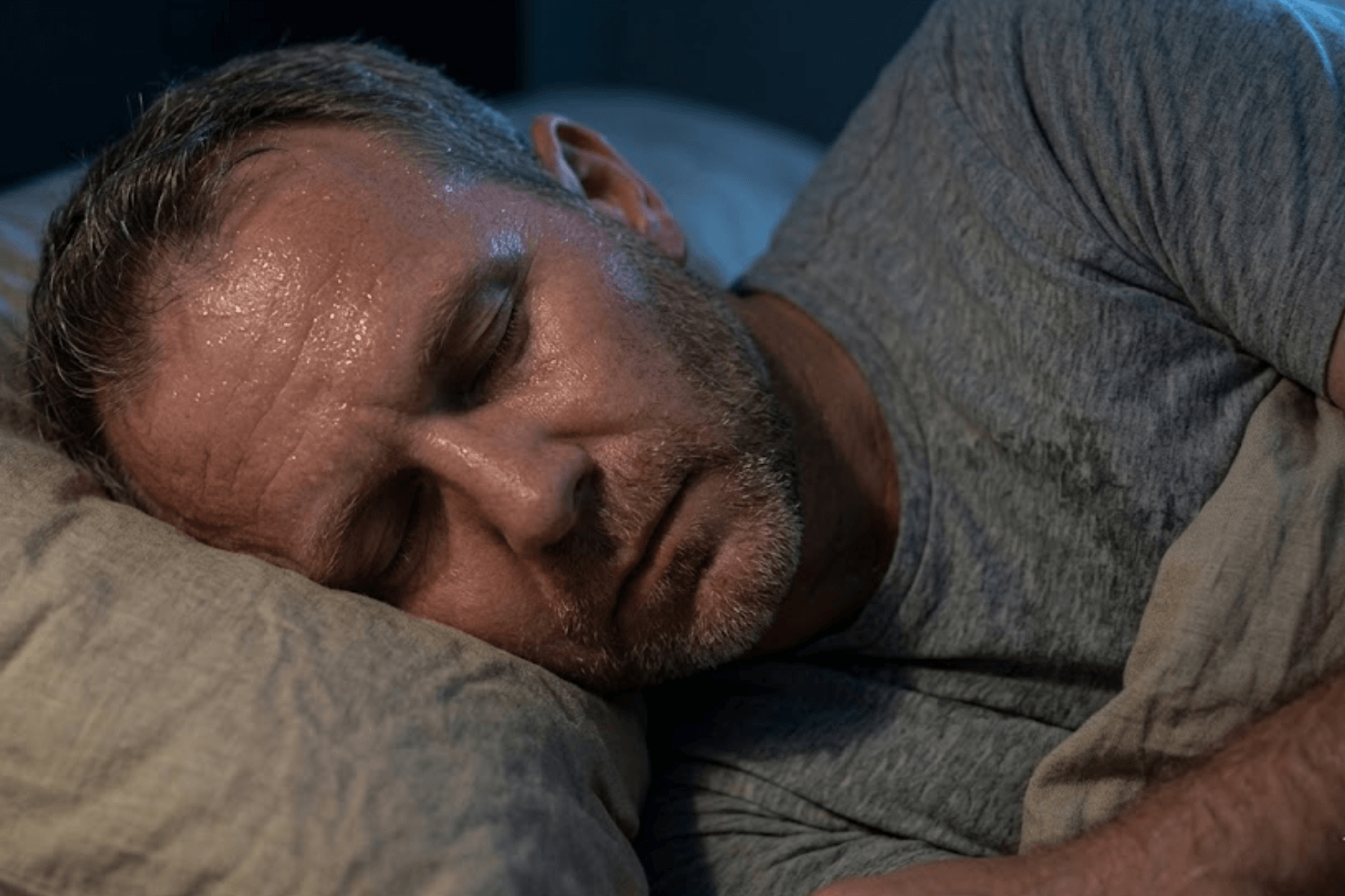 Man over 40 sleeping in breathable sleepwear