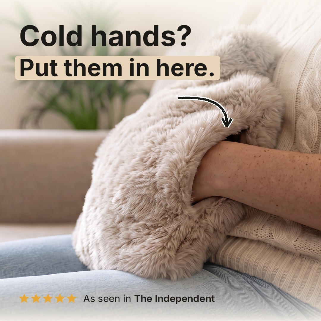 Cold hands? Put them in here. Hands inside the pouch of the Oatmeal faux fur hot water bottle