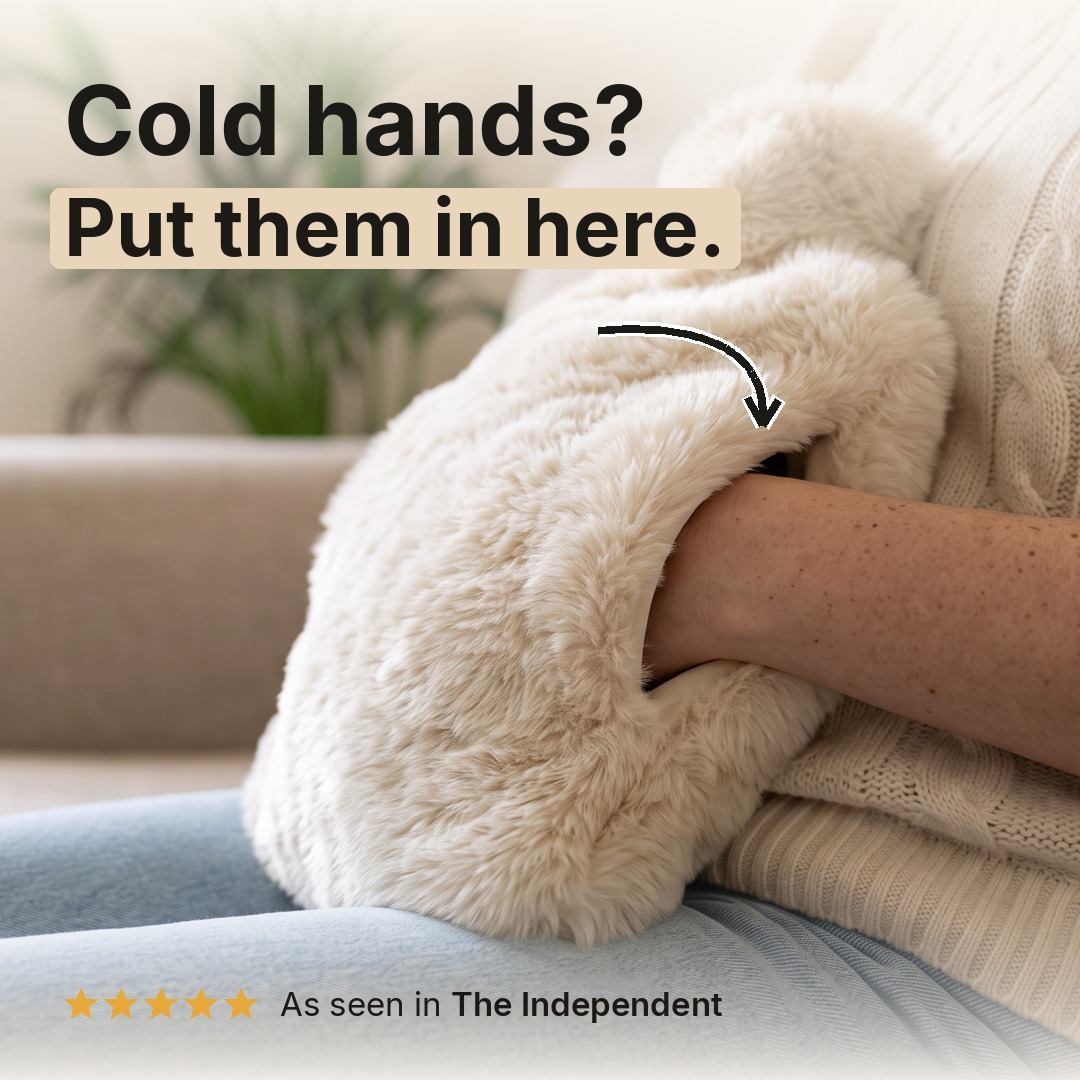 Cold hands? Put them in here. Hands inside the pouch of the Polar Bear faux fur hot water bottle