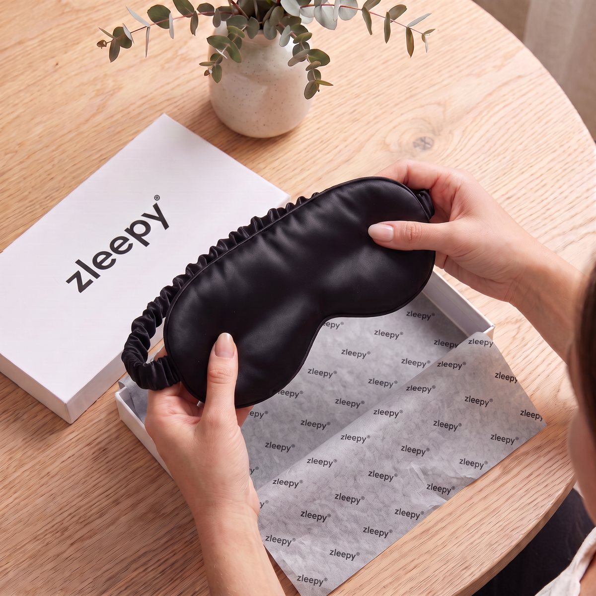 The 3D Blackout Silk Sleep Mask being unboxed from its gift box