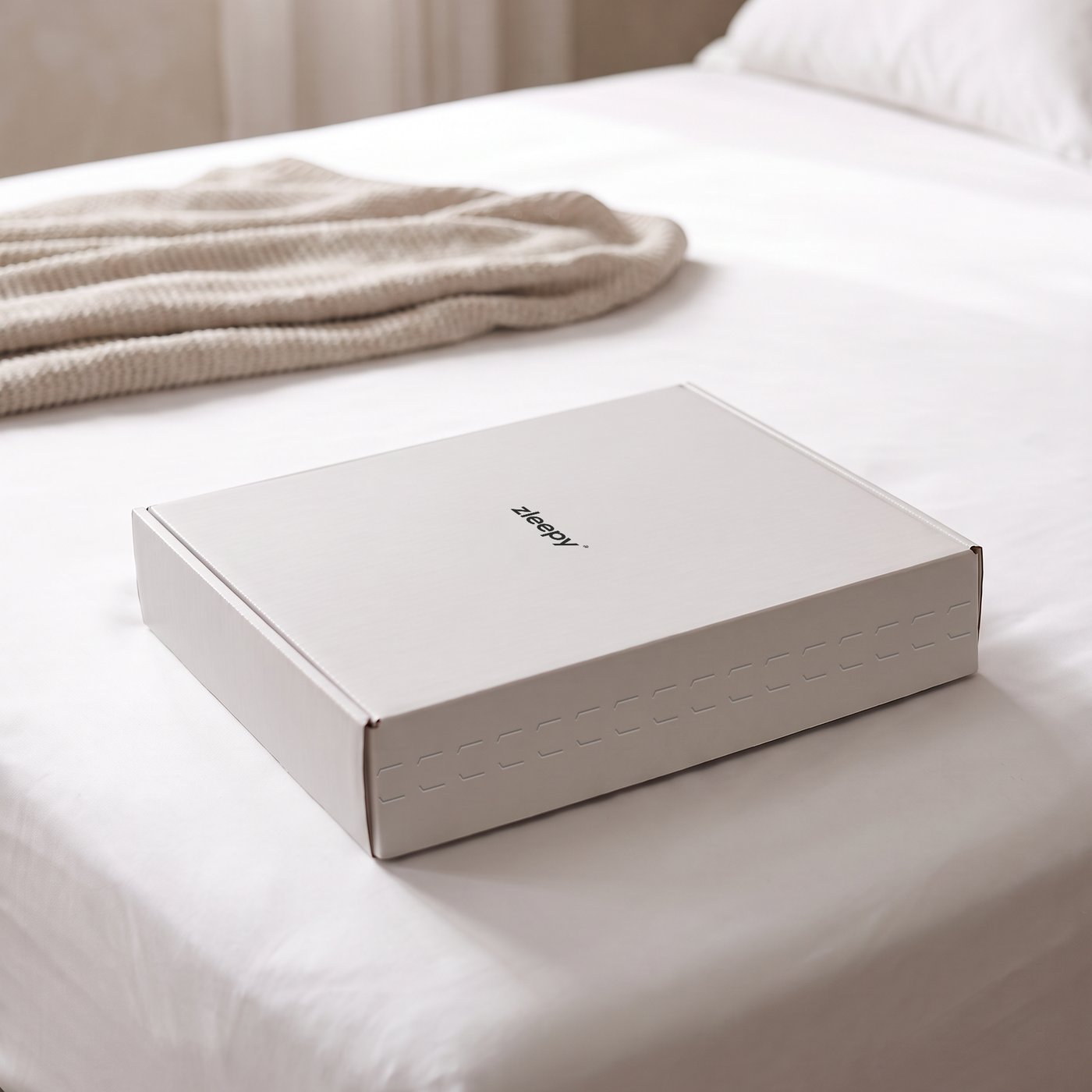 ZLEEPY bamboo fitted sheet box on a bed